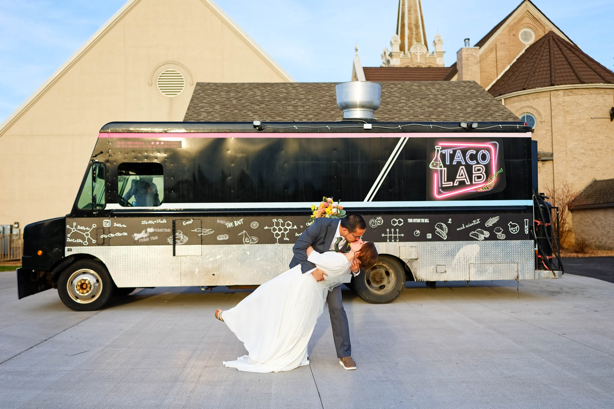 Bride and groom with taco lab food truck