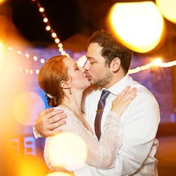 fine art creative portrait of bride and groom with yellow light