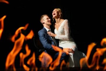 creative picture of the bride and the groom taken trough flames