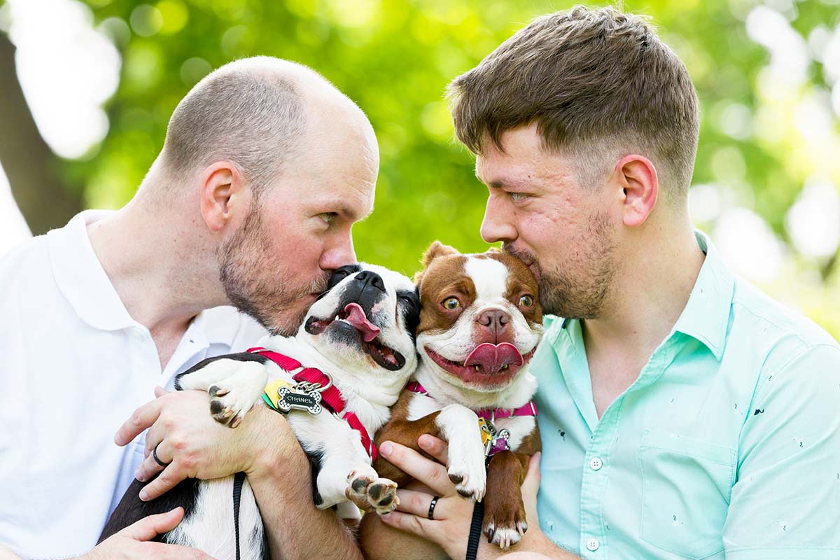 gay-couple-kissing-their-dogs-on-the-chick