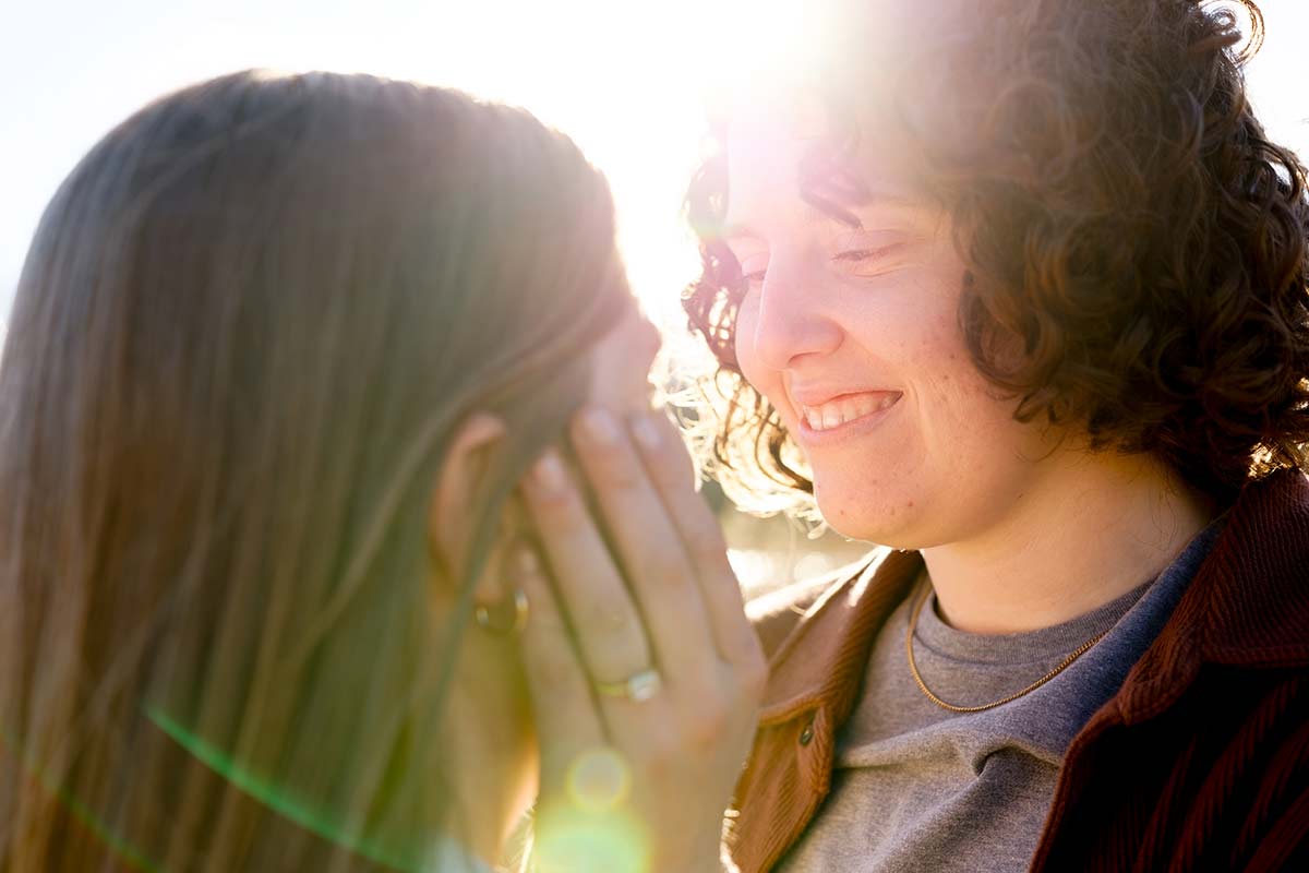 lesbian-engagement-photoshoot-closeup-on-fiancee-face-with-sun