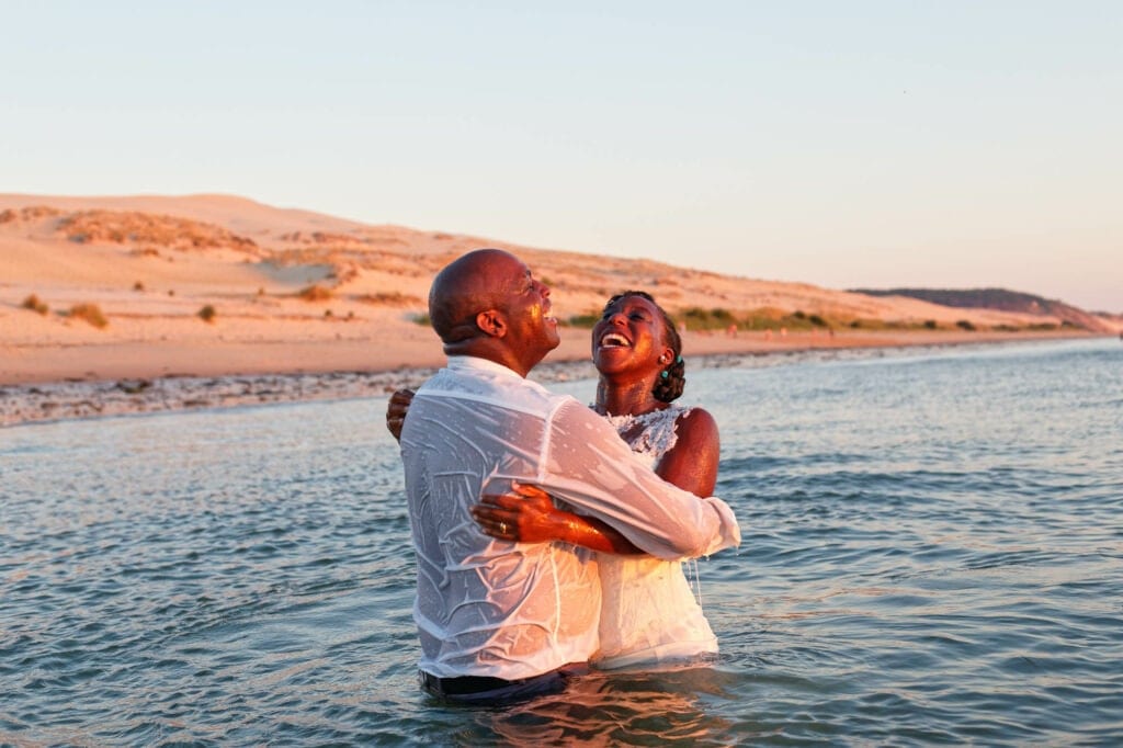 bride and groom in the ocean