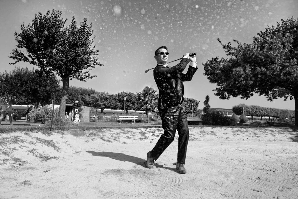 groom having fun golfing