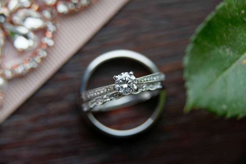 close up on engagement and wedding rings