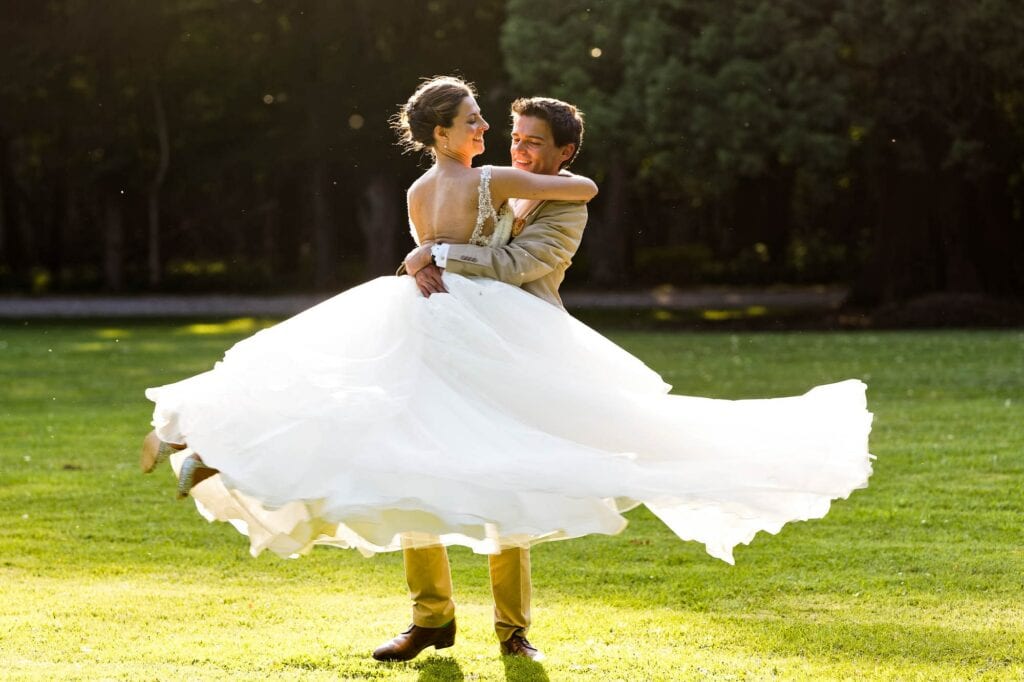 groom lifting and spining the bride