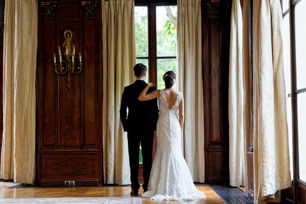 couple looking outside in a castle