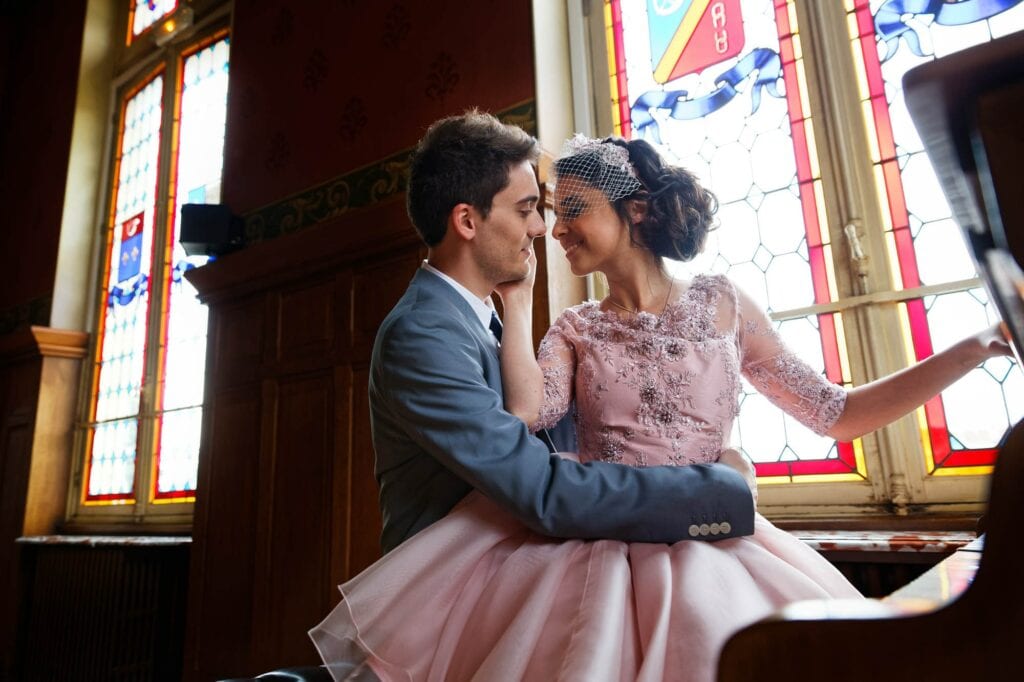 couples with piano and stained glasses