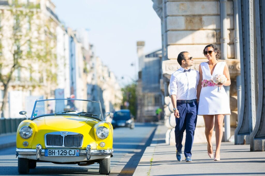 couple with yellow car