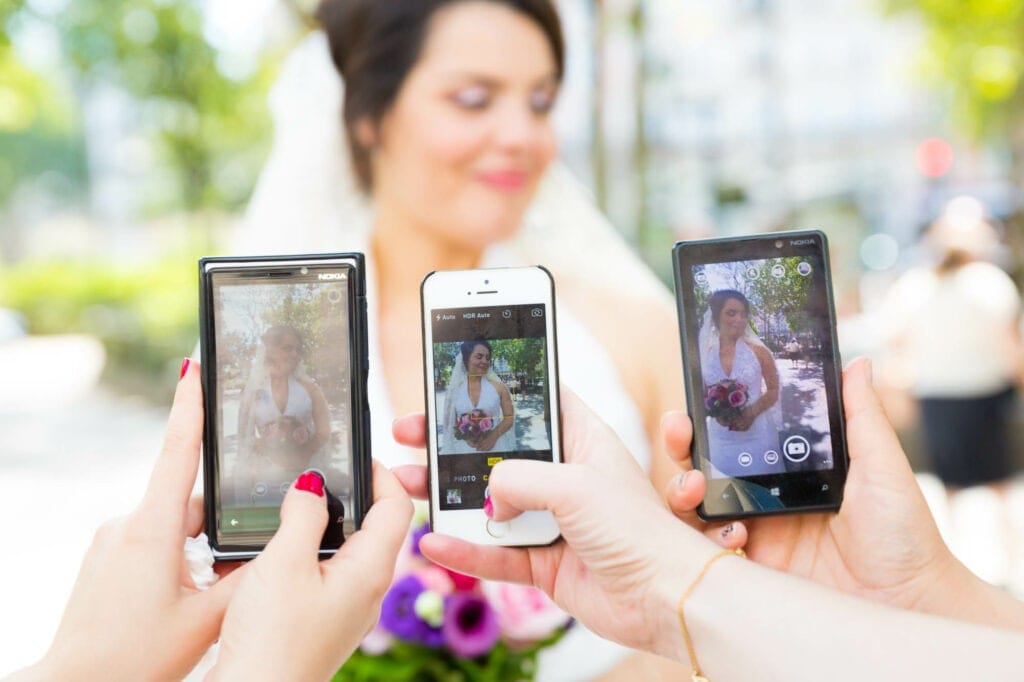 guests turned into paparazzi taking pictures of the bride with their phones