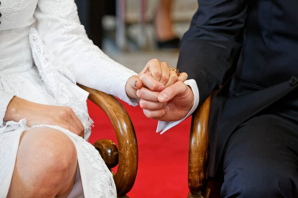 bride and groom holding hands