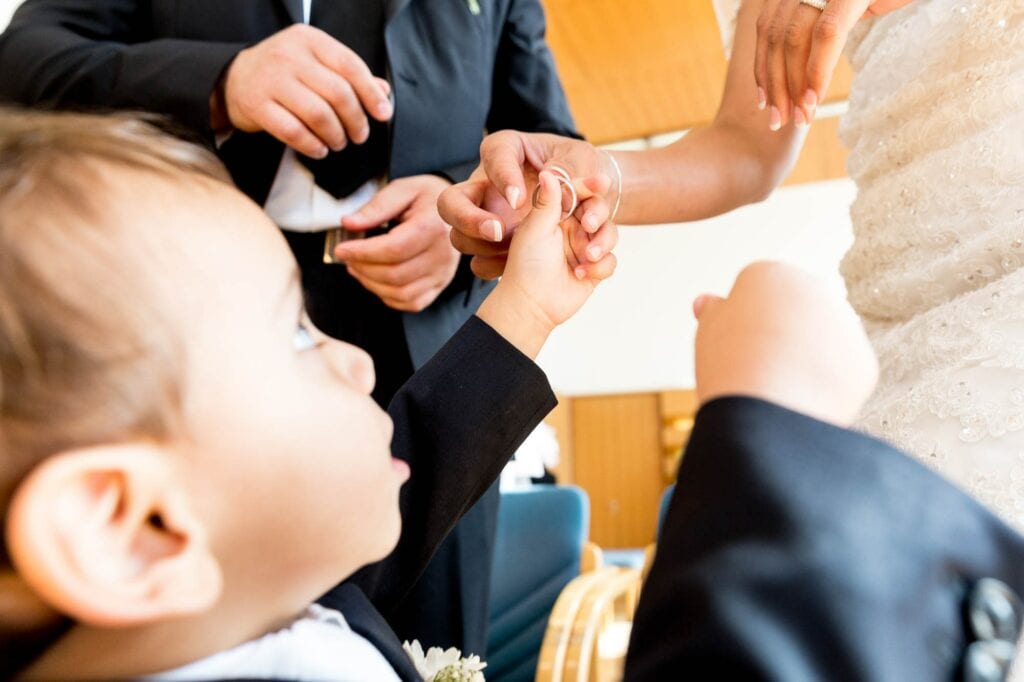 baby giving wedding ring to the bride