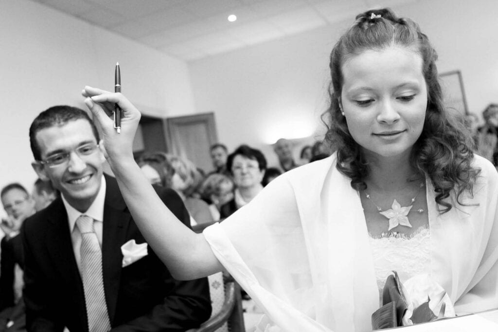 bride asking for silence when reading the wedding certificate