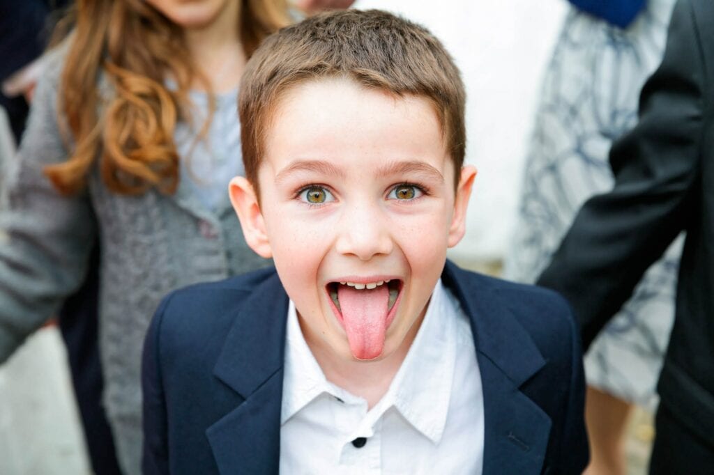 boy sticking his tongue out