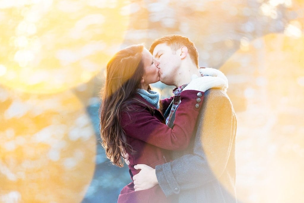 couple photo shoot kissing in front of the lens