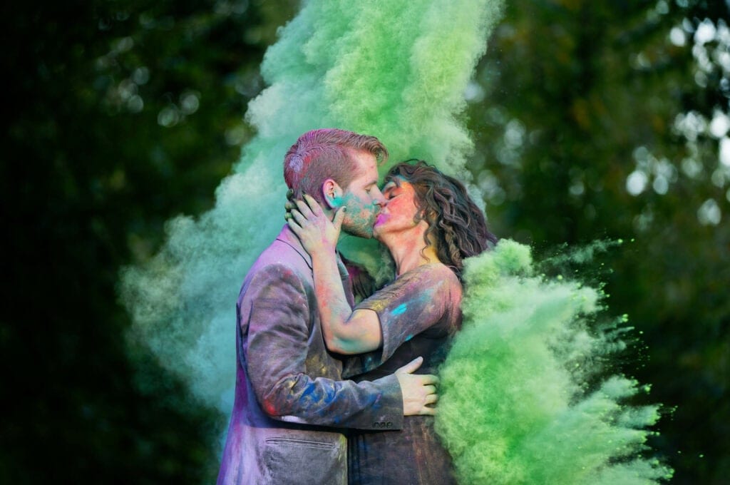 creative photoshoot for engagement with color chalk powder