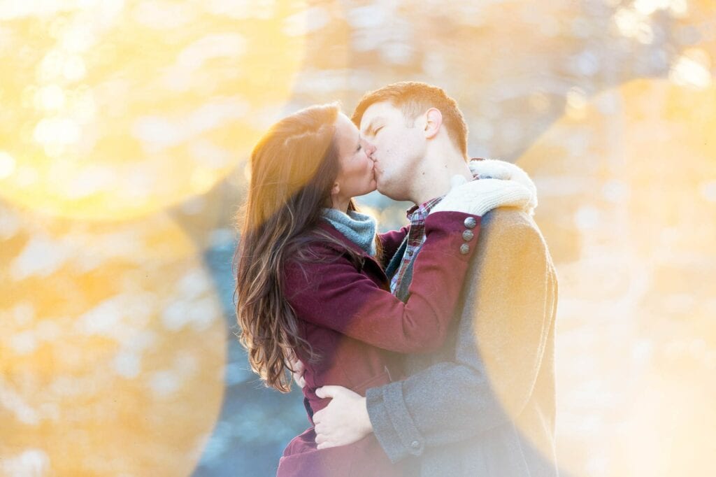 couple photo shoot kissing in front of the lens