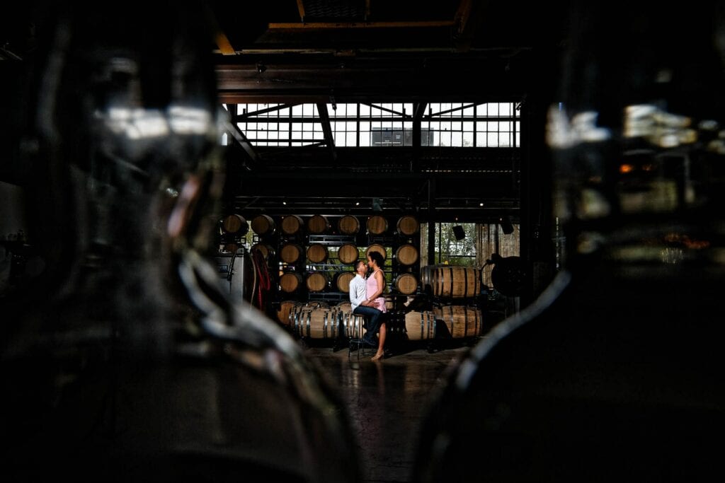 artistic engagagement photo in minneapolis brewery by their engagement photographer