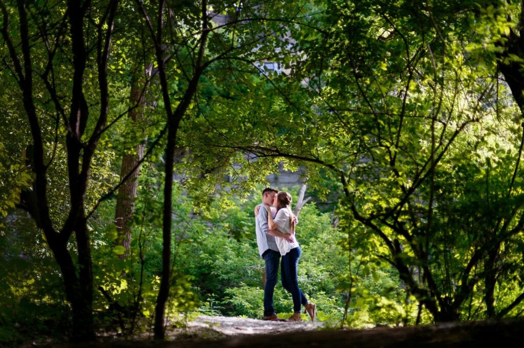 pre wedding shoot of couple kissing in nature