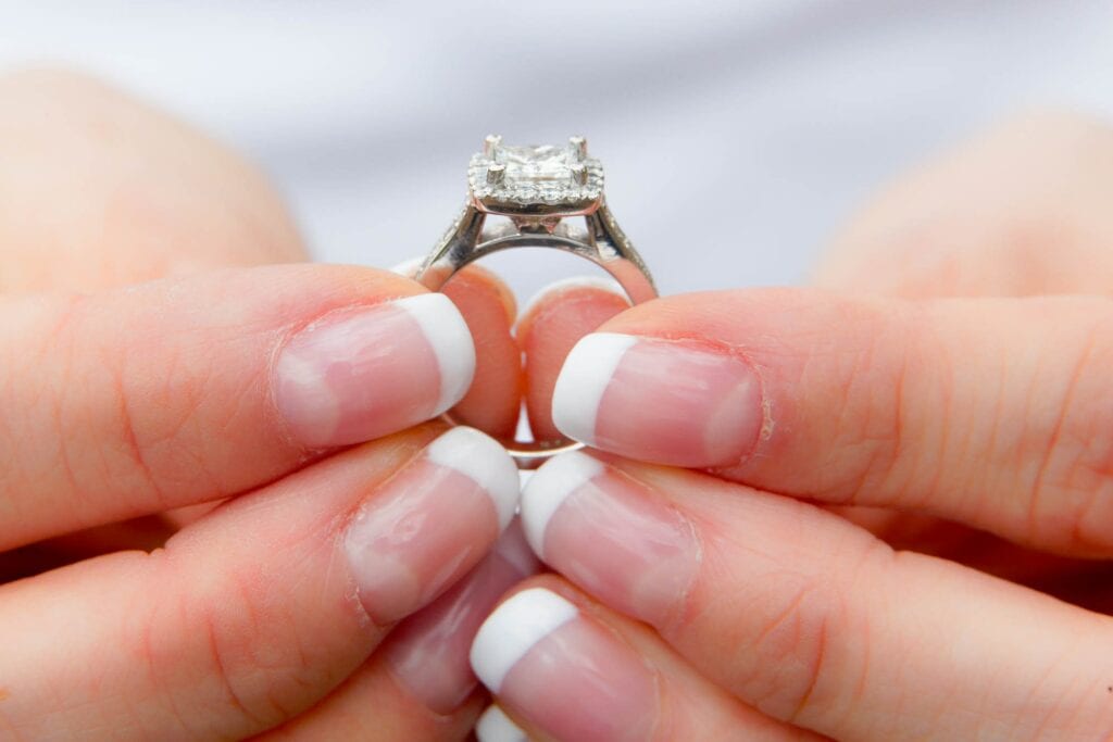 fiance holding her engagement ring