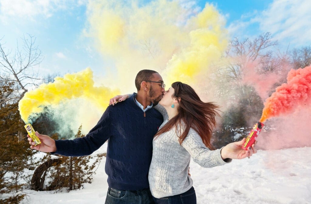 yellow and red color smoke bomb engagement photos