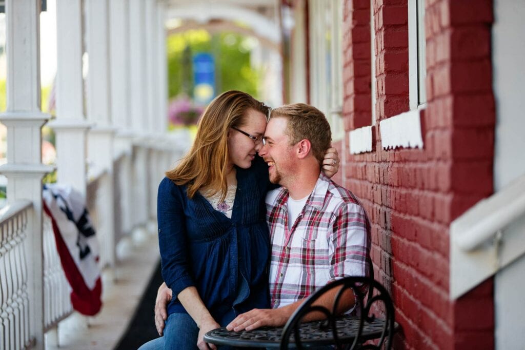 newly engaged lovers nuzzling at faribault mn