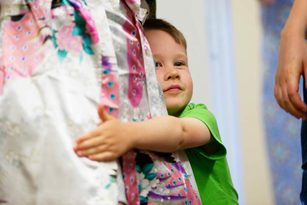 nephew hugging the bride