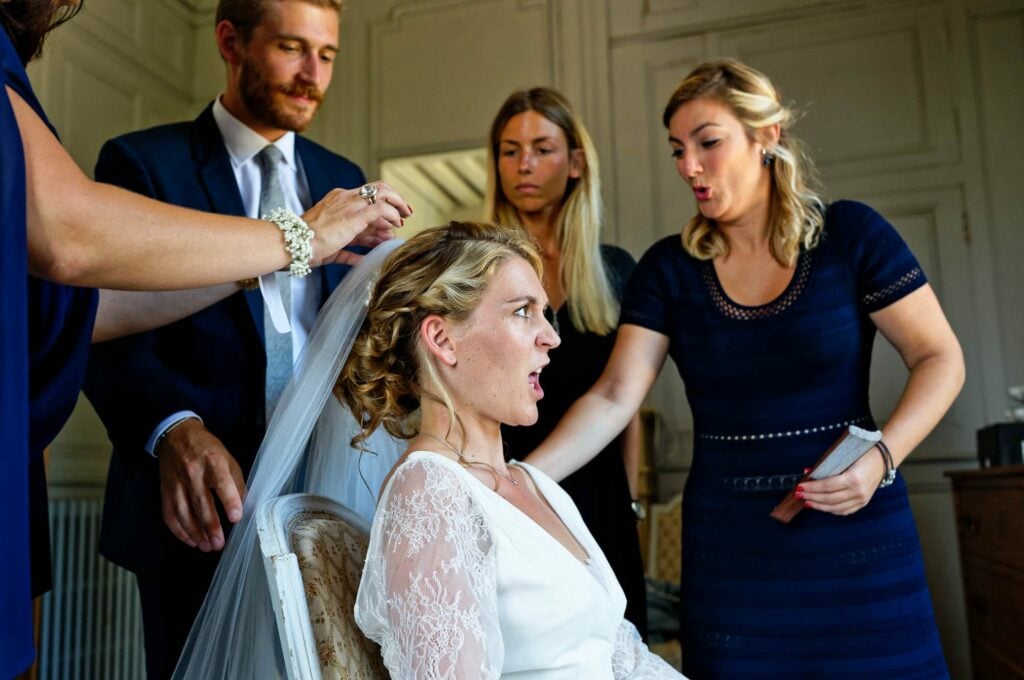 bride doing silly face having her hair done