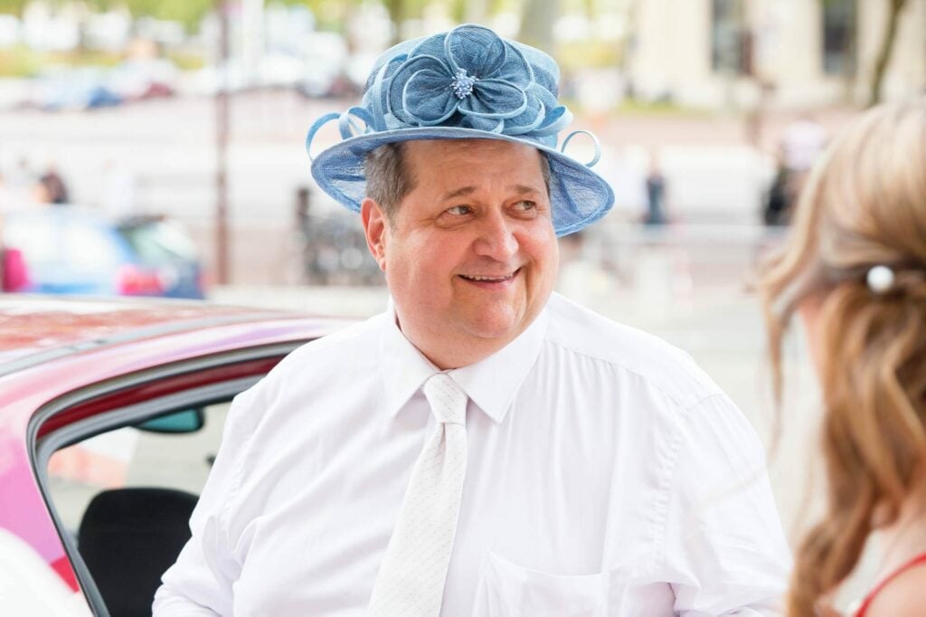 father of the bride wearing mothers hat