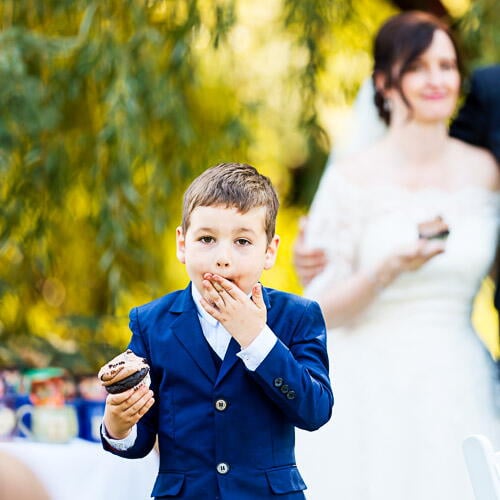 Child Eating Muffin During Wedding Toast Minneapolis