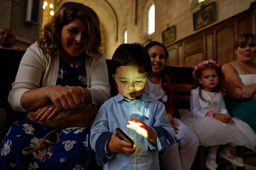 toddler playing with phone during sermons