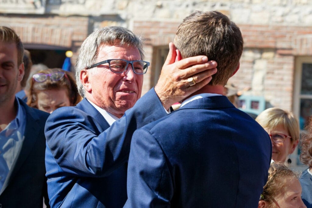 Father of the groom congratulating his son