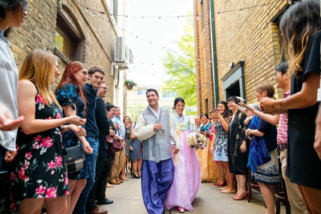 bride and groom arrival to cocktail hour in korean outfit