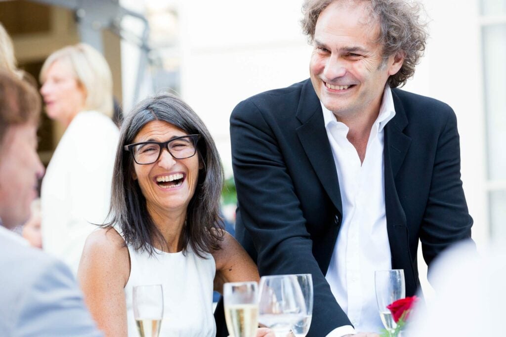 guests laughting together during reception