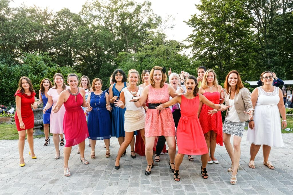 all the single ladies ready to catch the bouquet during the bouquet toss