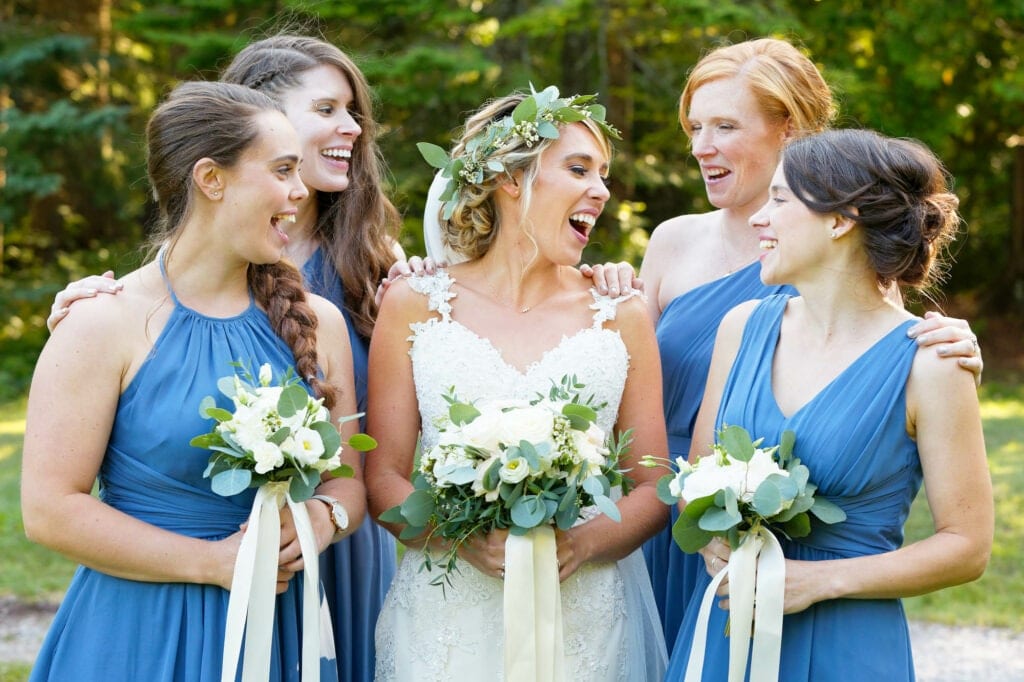 bride and her bridesmaids with blue dress