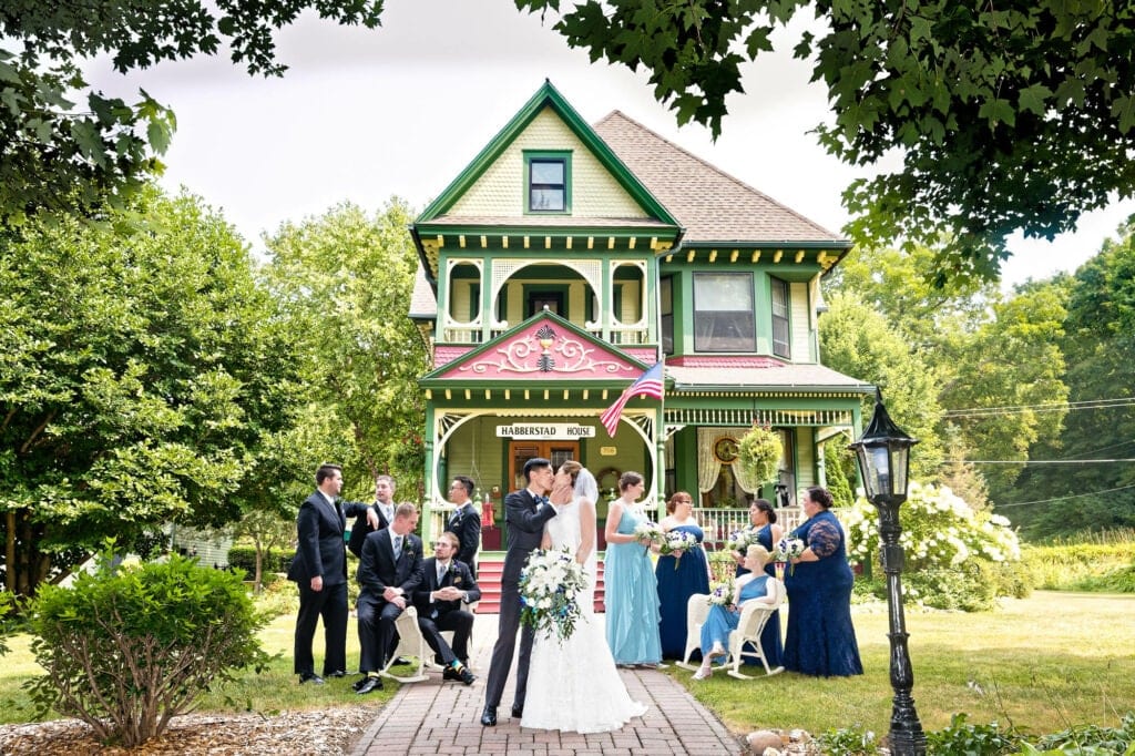 group picture in front of old house