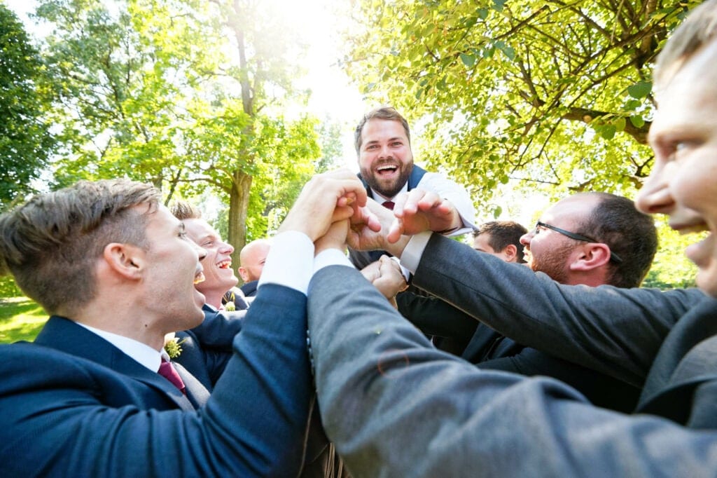 throwing the groom into the air