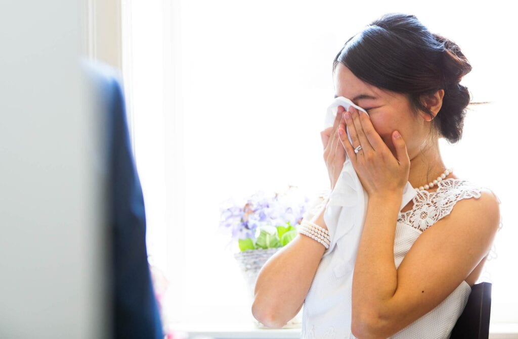 bride hidding her tears during speech