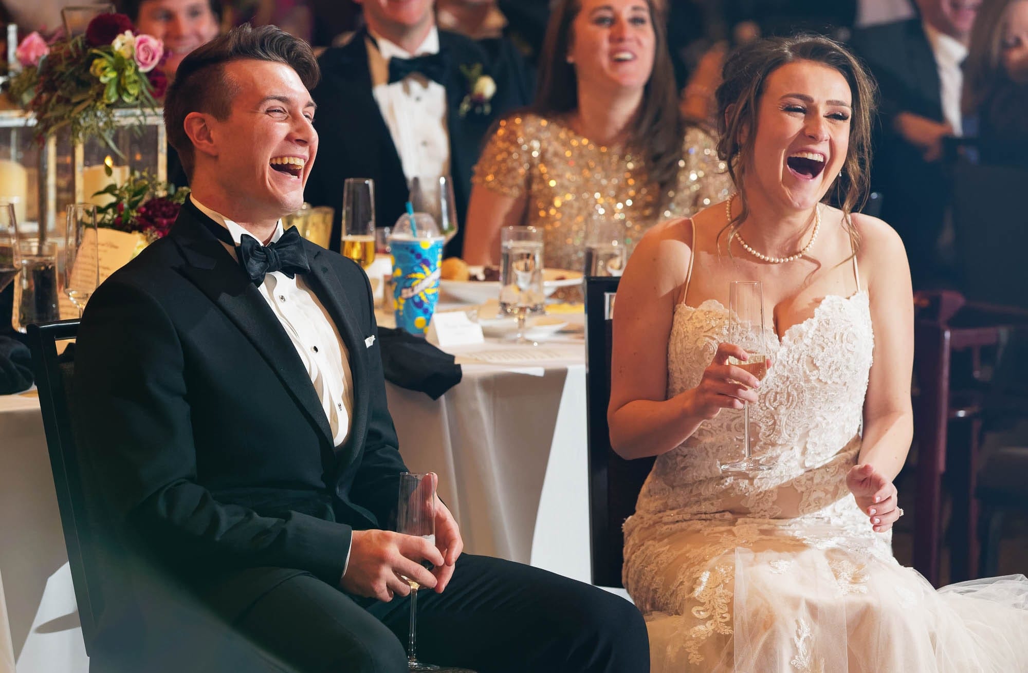 husband and wife laughing during speeches