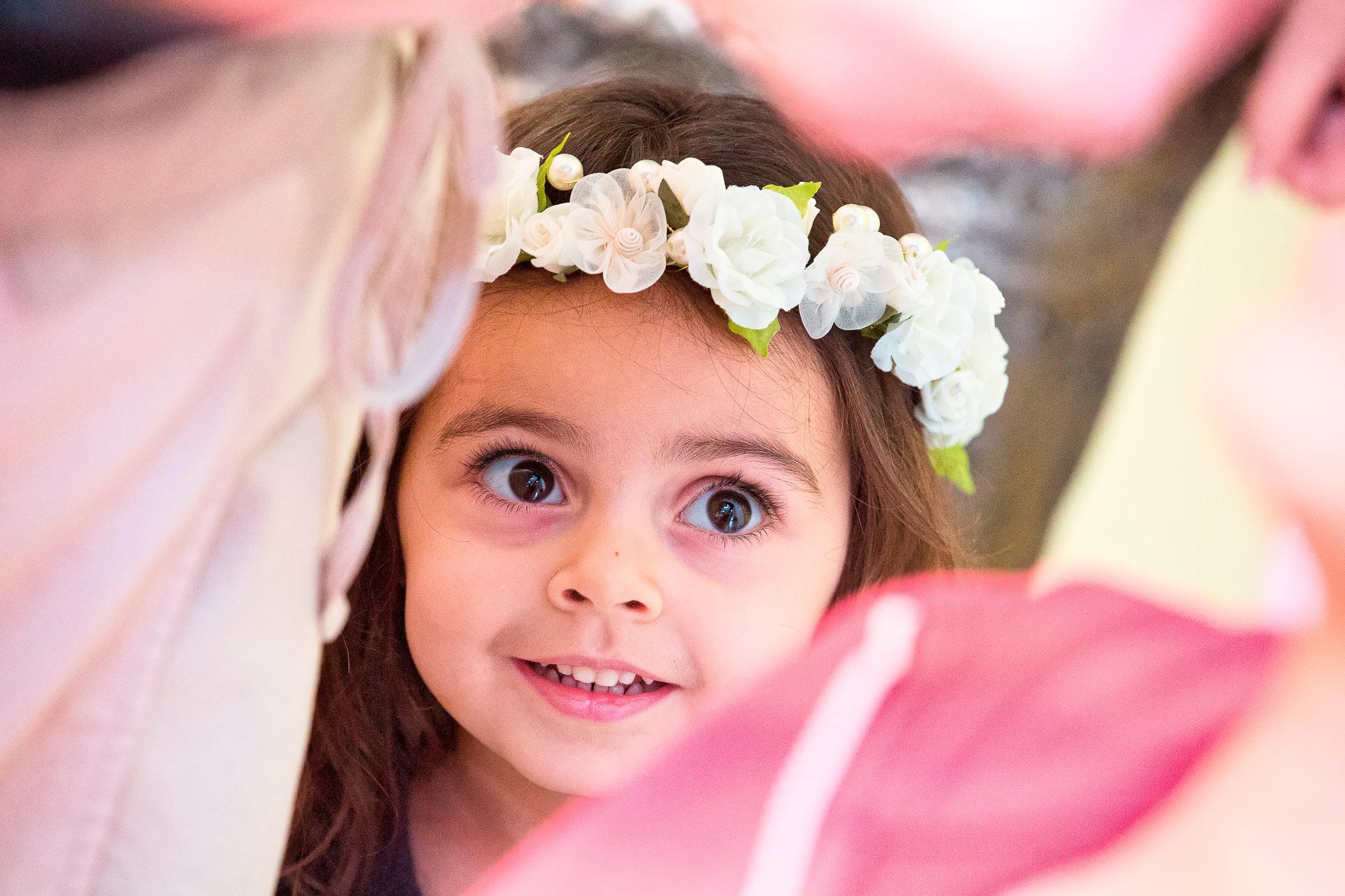 Flower Girl Admiring Bride During Wedding Preparations