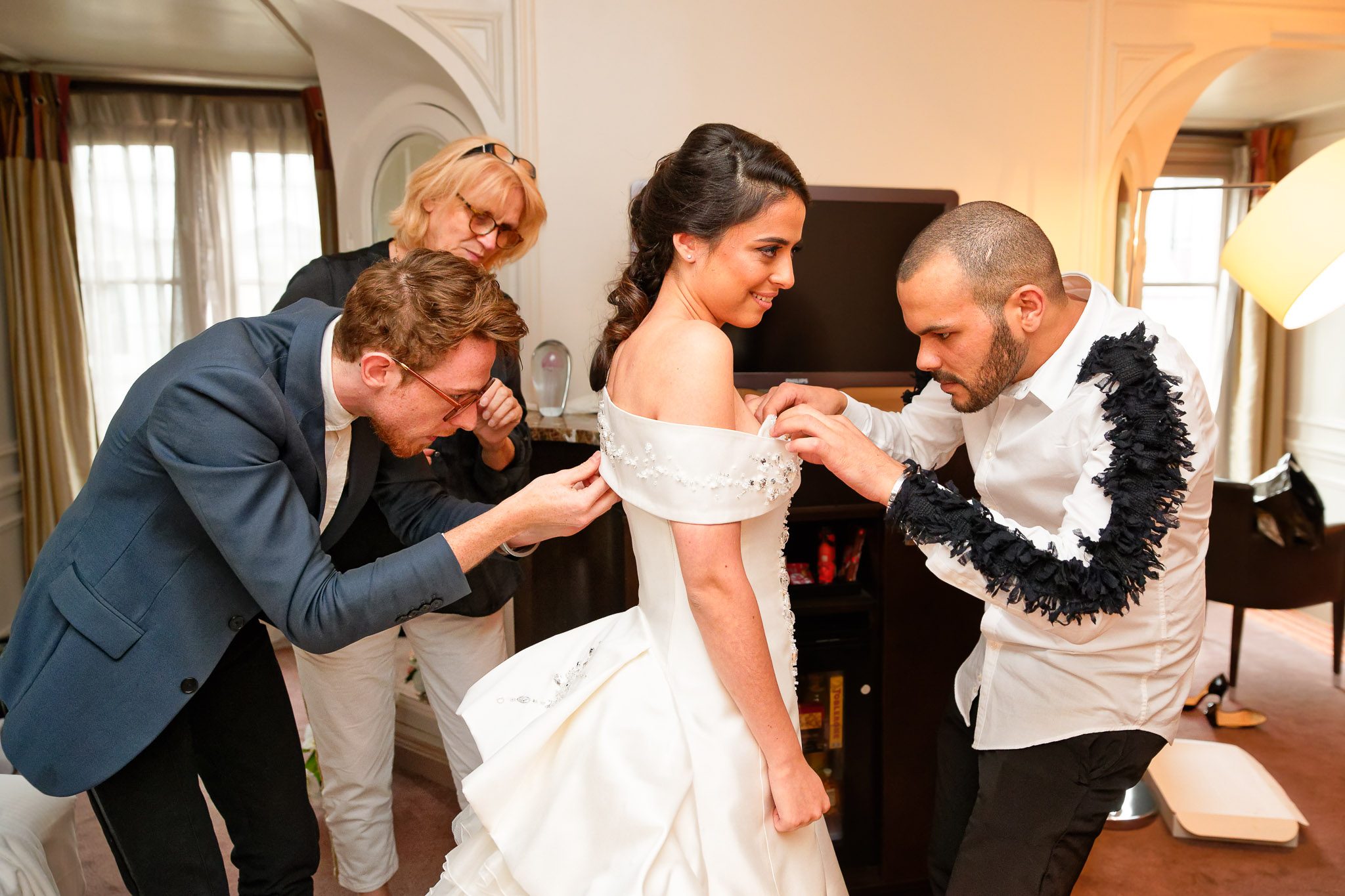 Wedding Stylists Preparing Bride in Paris Hotel Suite