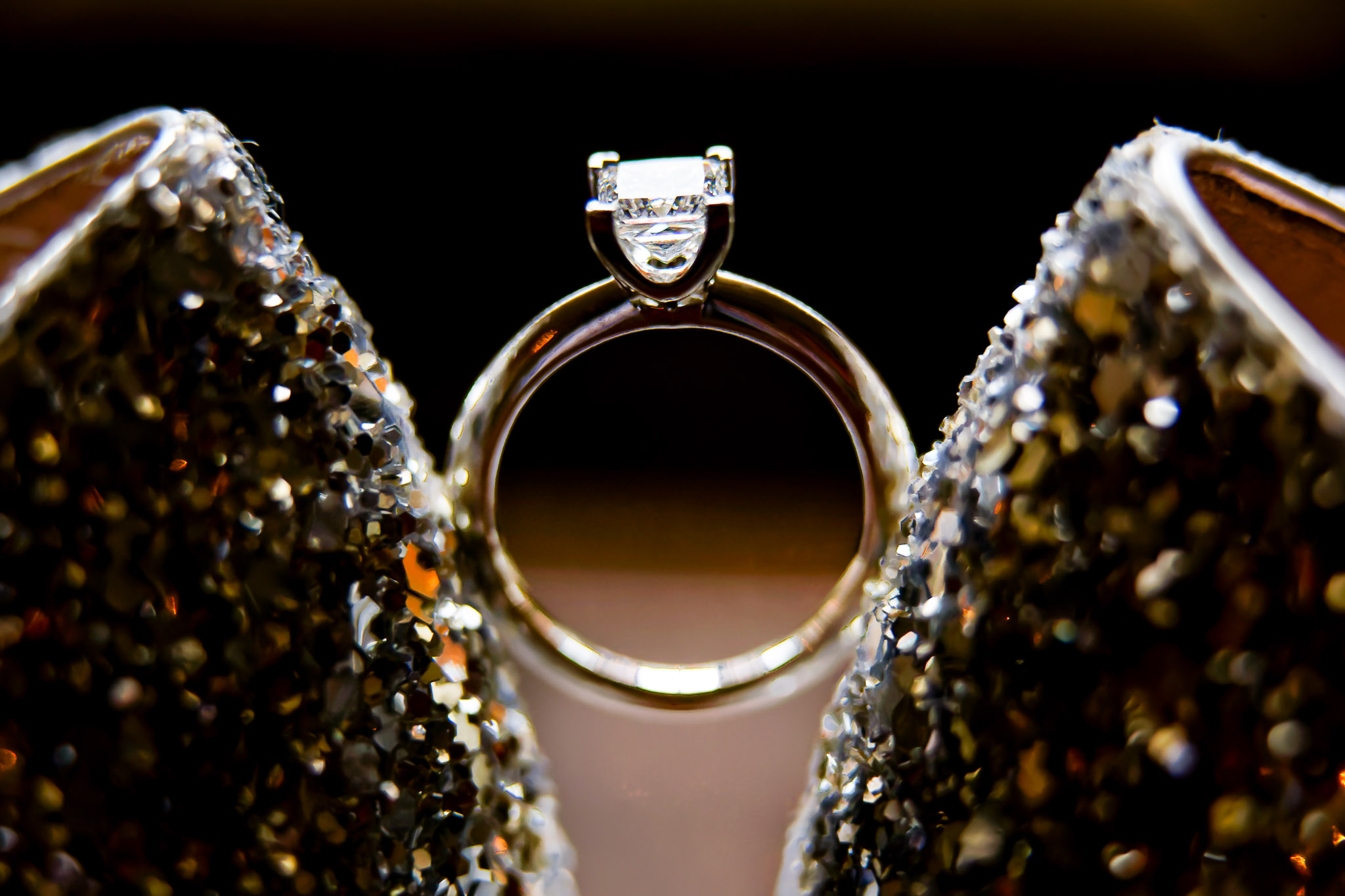 Wedding Rings on Sparkly Bridal Shoes Detail Shot