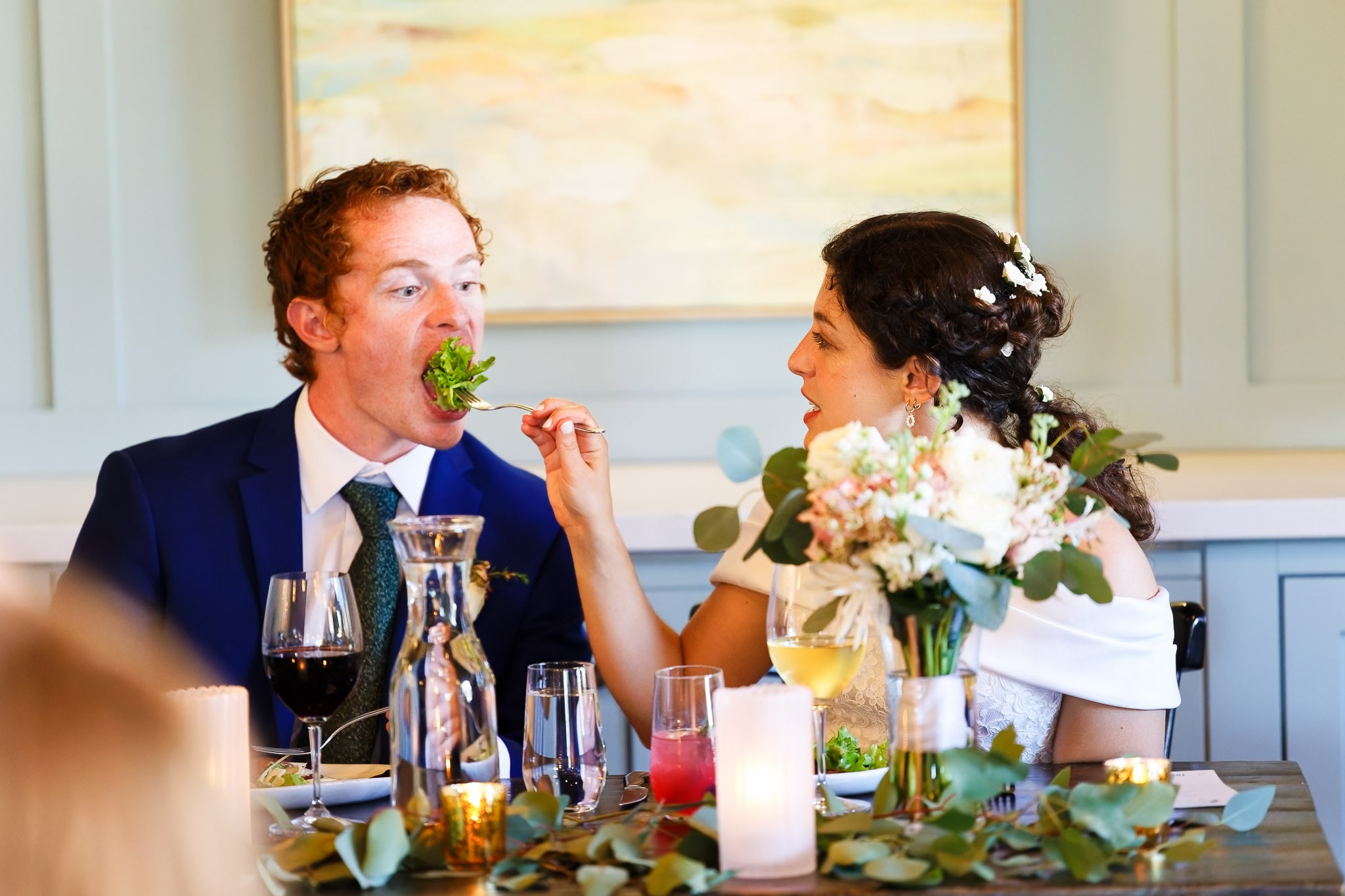 Bride Feeding Groom During Reception Dinner Minneapolis Wedding