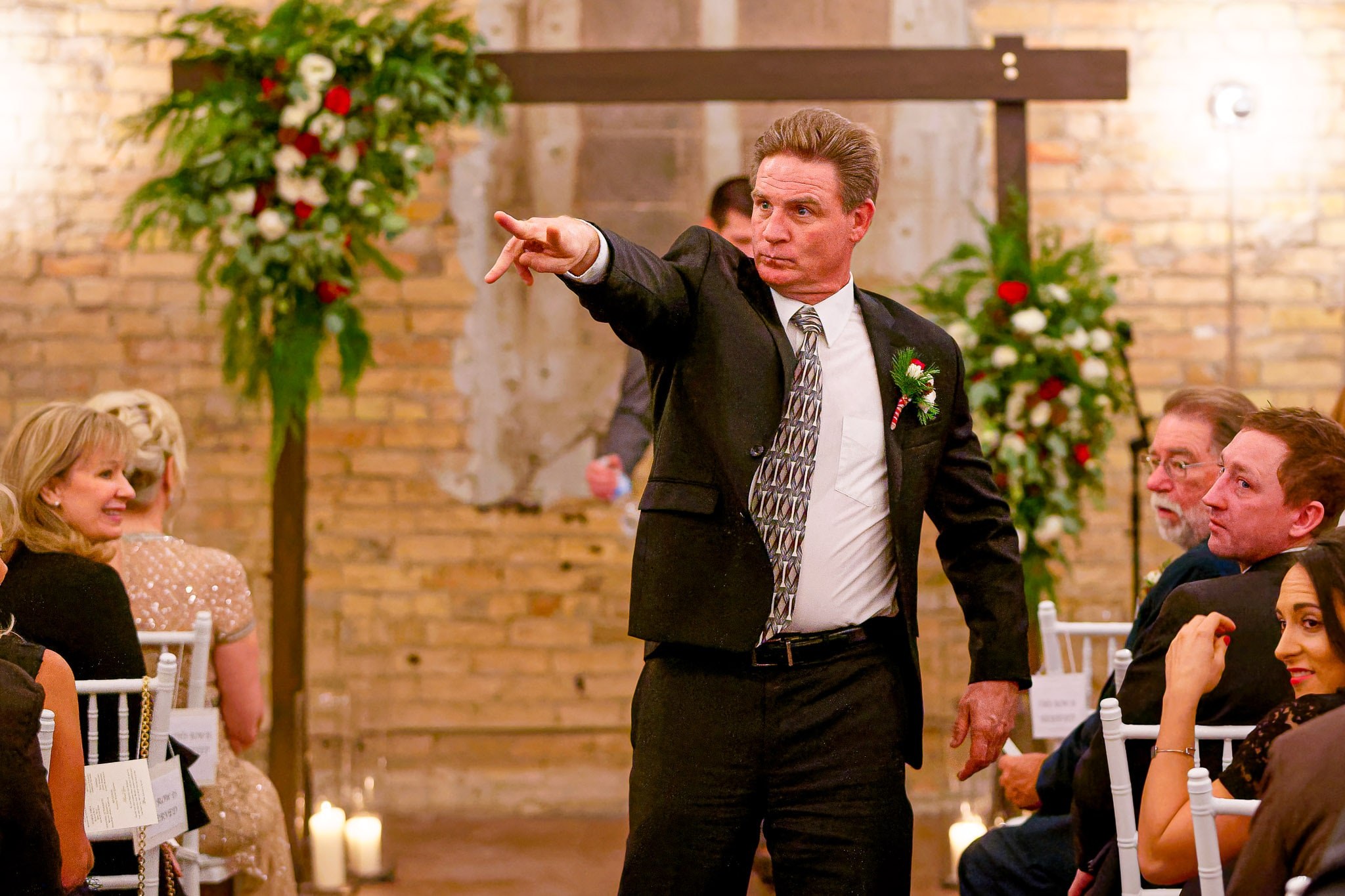 Father Coordinating Wedding Ushers Before Ceremony