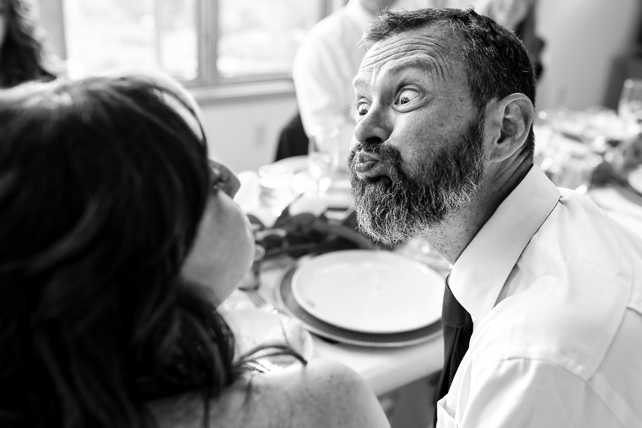 Groom Makes Silly Face to Bride - Lutsen Wedding Reception