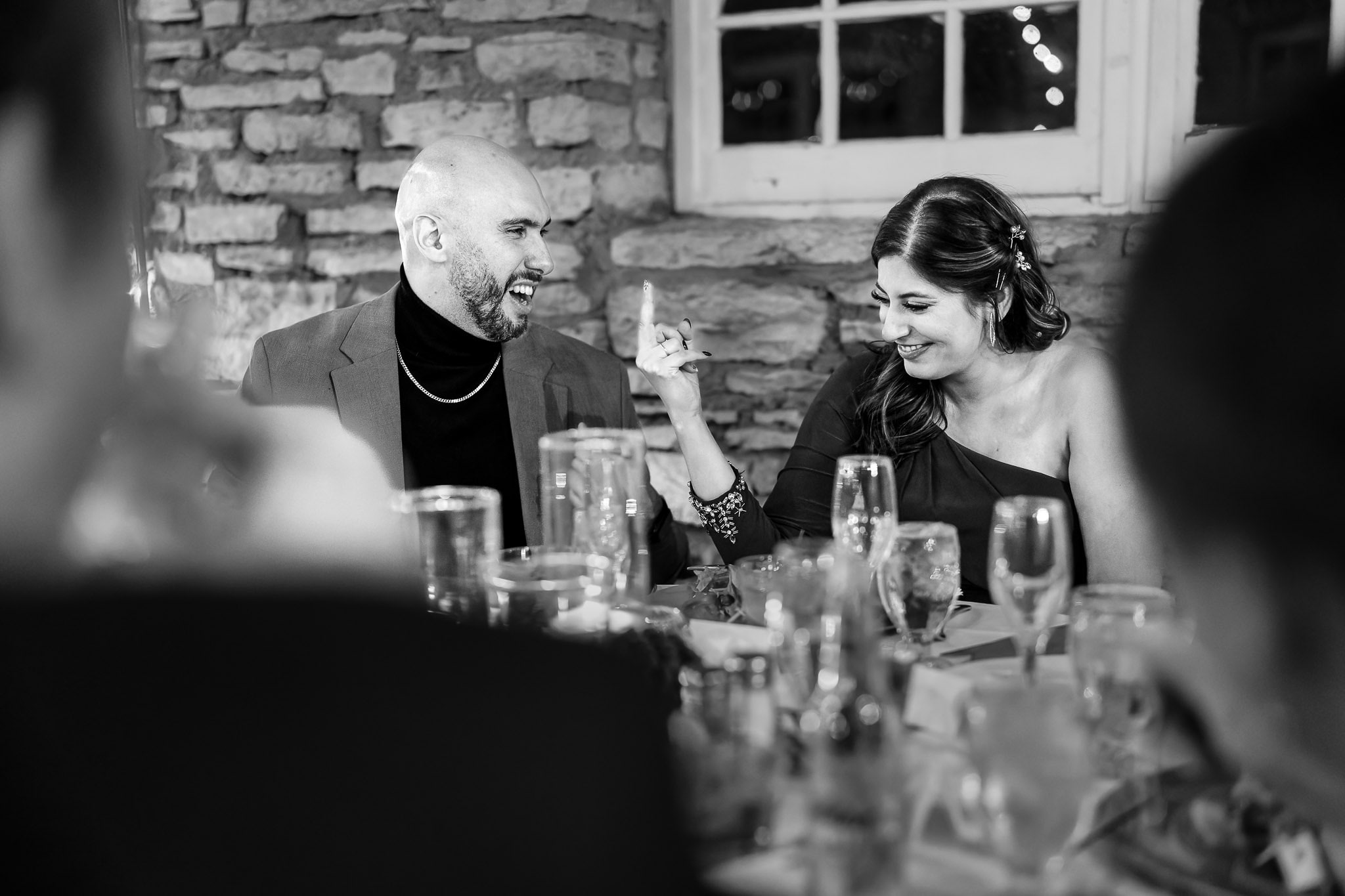 Playful Wedding Dinner Moment at Mayowood Stone Barn Rochester