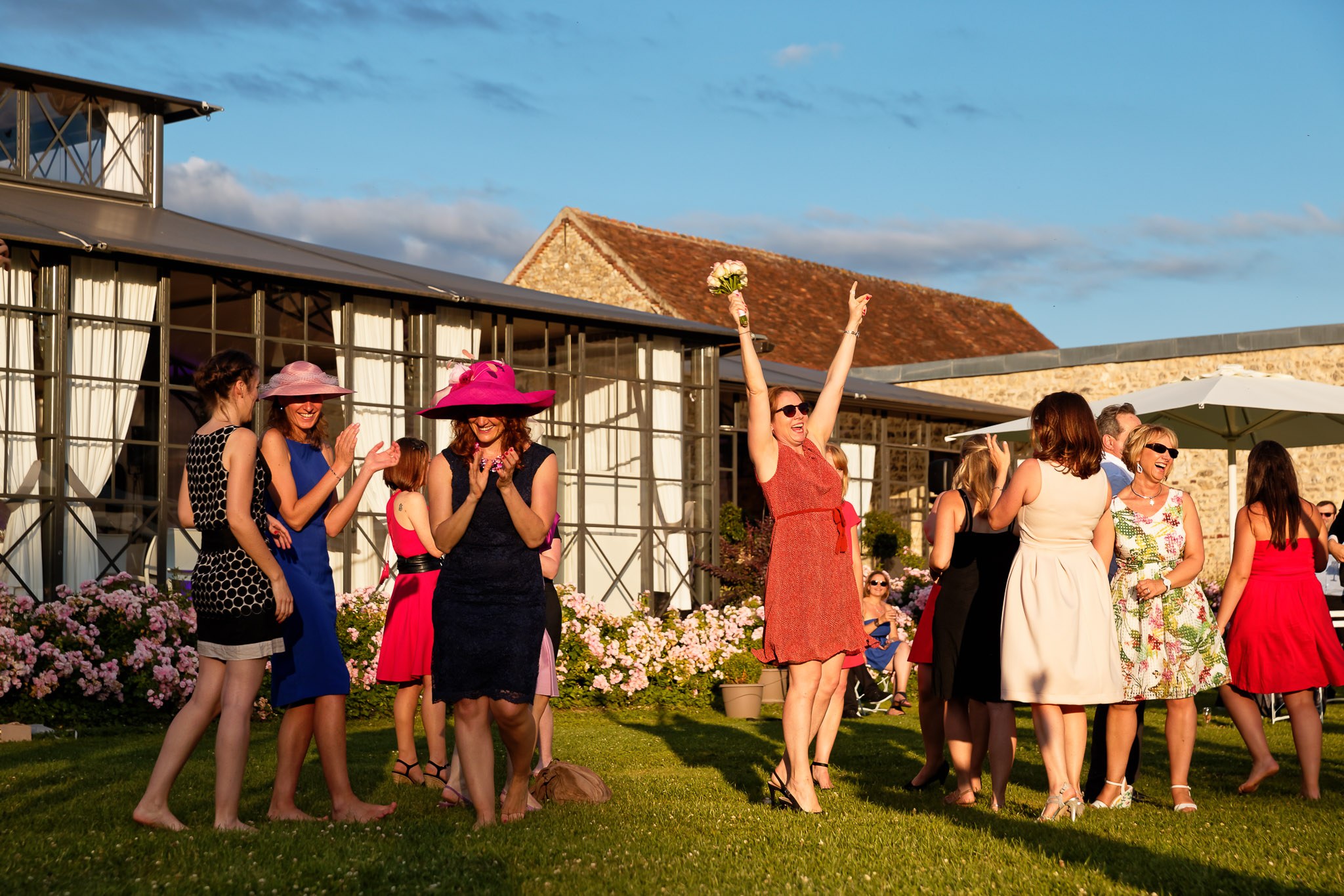 Woman Catches Wedding Bouquet in Celebration at Reception