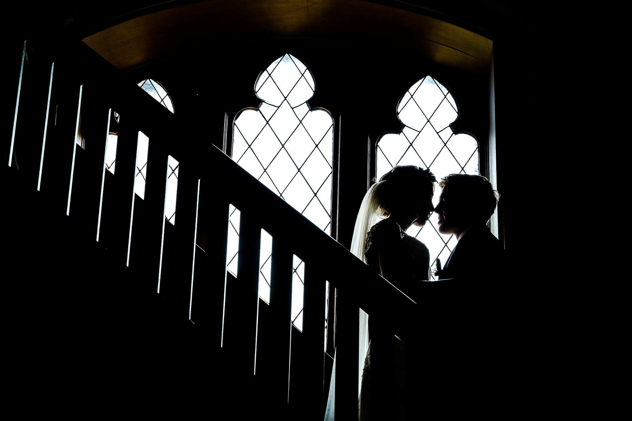 Church Staircase Silhouette Wedding Portrait with Gothic Windows