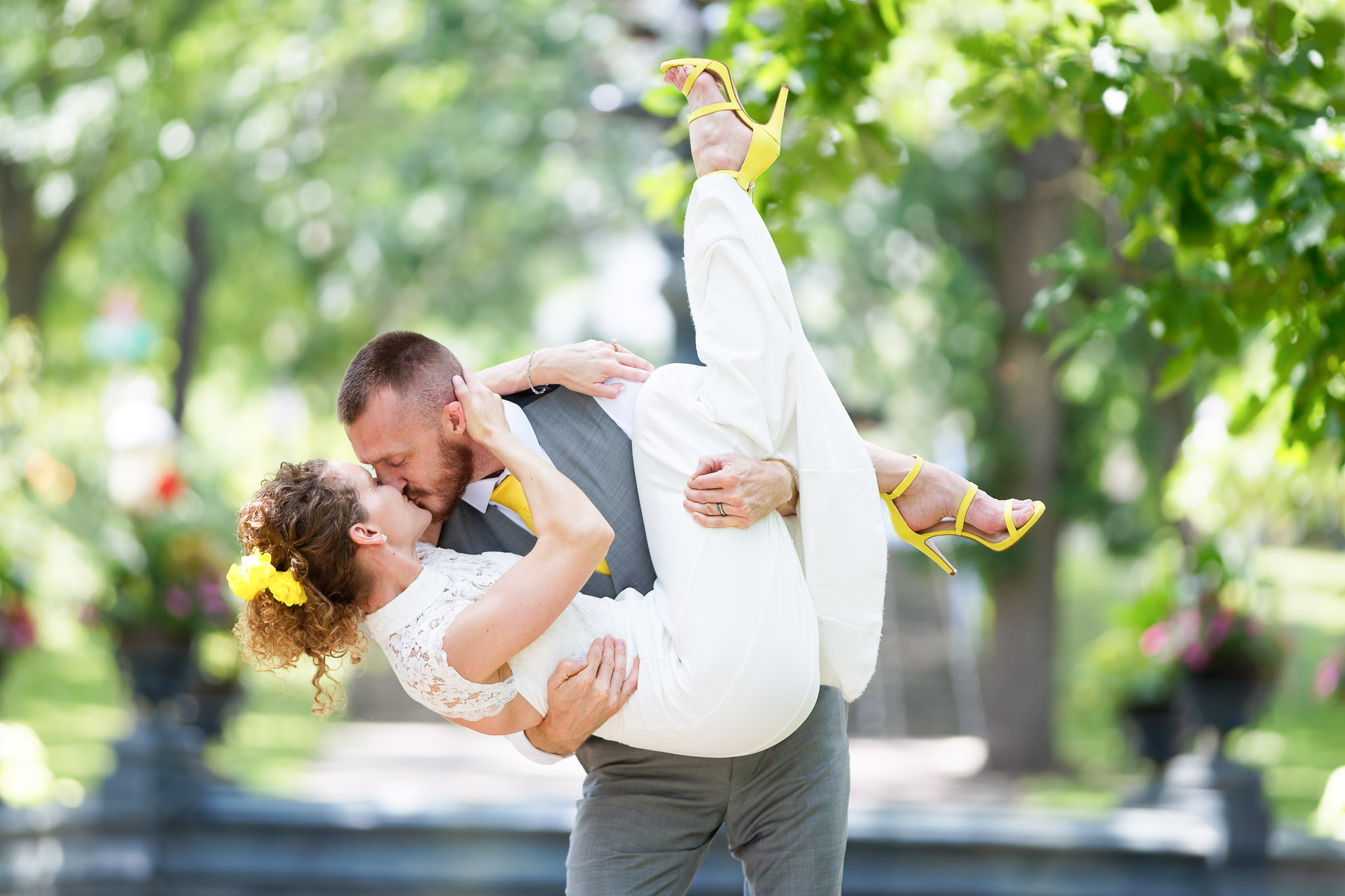 Groom Lifts Bride During Romantic Wedding Portrait Session