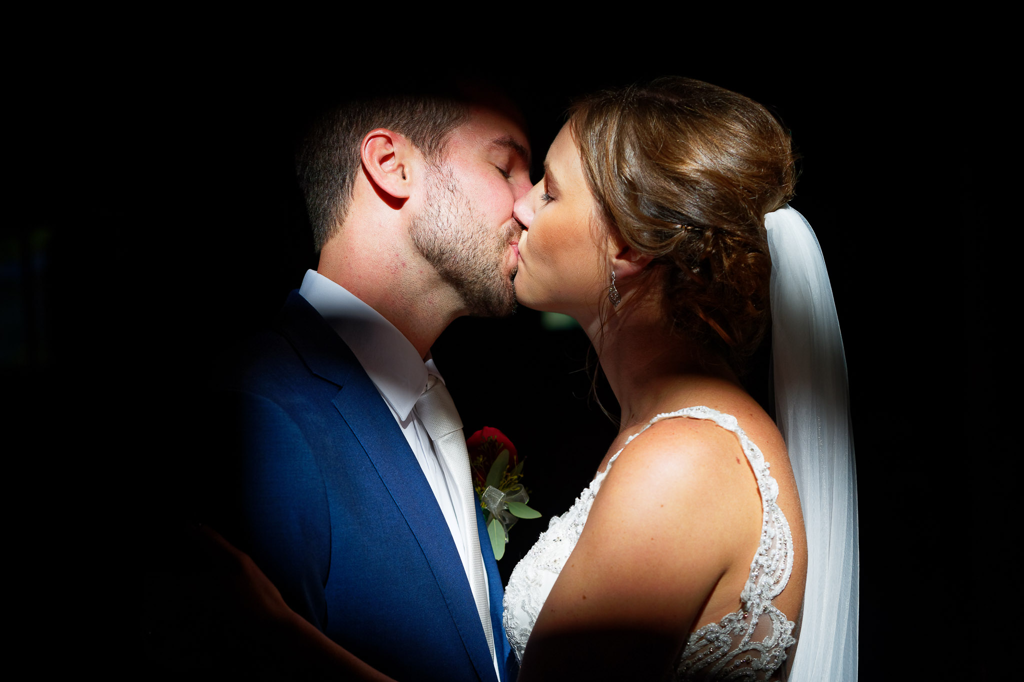 Dramatic Light and Shadow Wedding Kiss Portrait